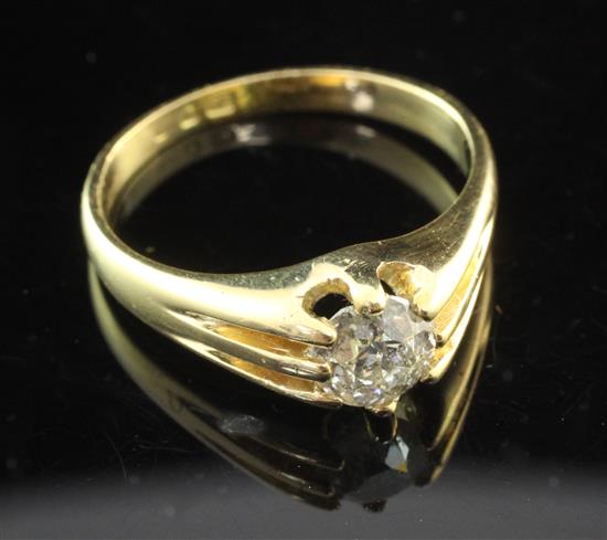 A mid 20th century 18ct gold and claw set solitaire diamond ring, size T.